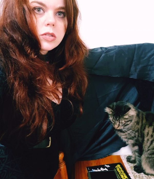 A-witch-her-familiar-and-their-ancient-tomes