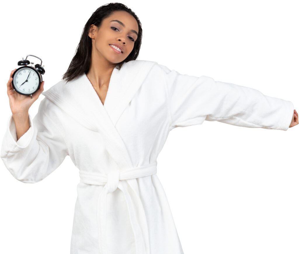 a woman in a white robe holding a clock
