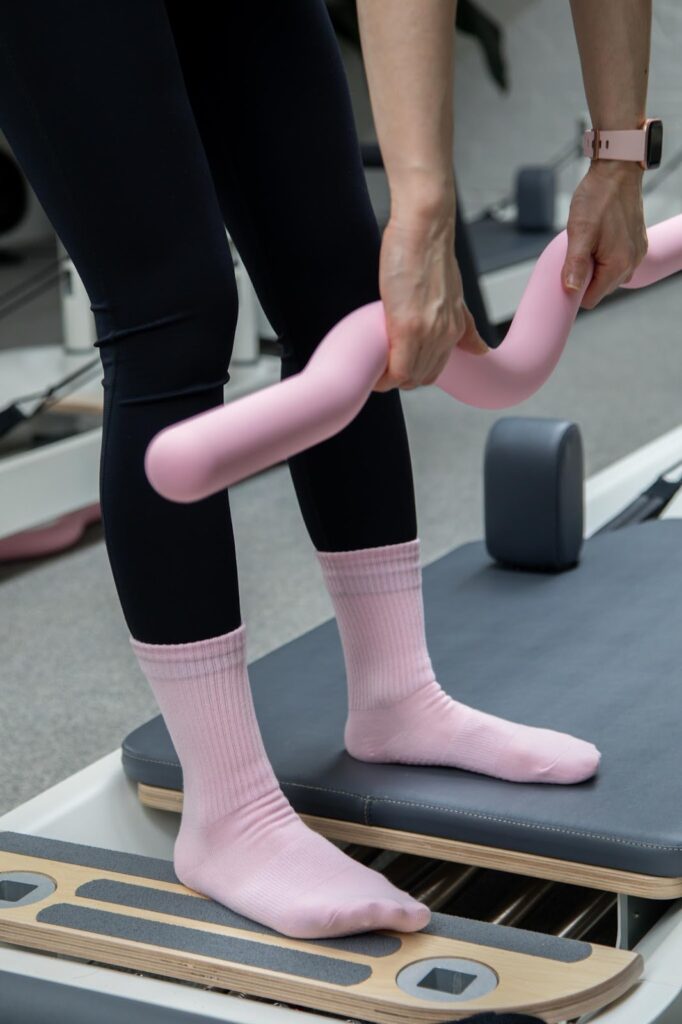 pink grip socks doing yoga